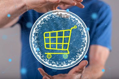 Arka planda bir adamın elleri arasında online alışveriş kavramı