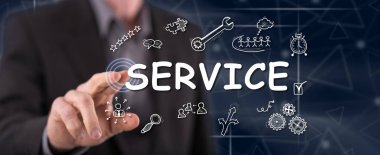 Bir adam dokunmatik ekranda bir servis konseptine parmağıyla dokunuyor.