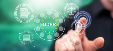 Adam dokunmatik ekranda GDPR konseptine parmağıyla dokunuyor.