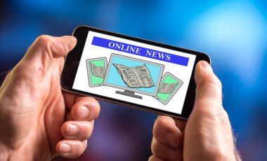 Bir smartphone online haber kavramı ile tutan el