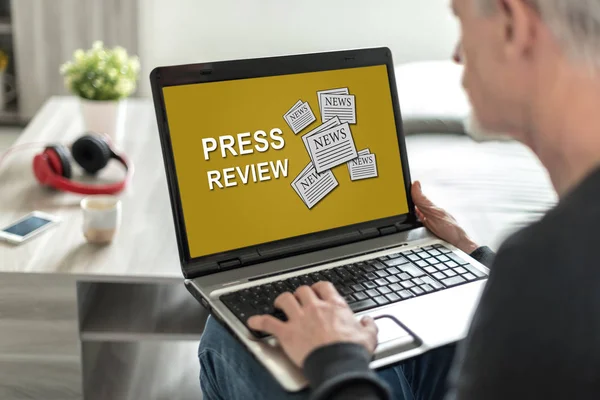 Laptop screen displaying a press review concept