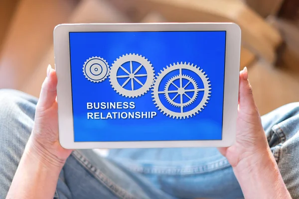 Tablet screen displaying a business relationship concept