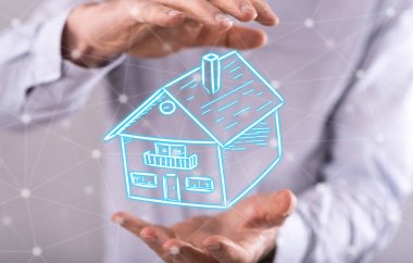 Arka plandaki bir adamın elleri arasındaki mülkiyet kavramı