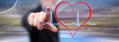 Adam bir kalp dokunmadan grafik bir dokunmatik ekranda parmağıyla yener