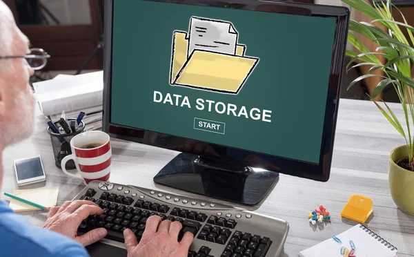 Man using a computer with data storage concept on the screen