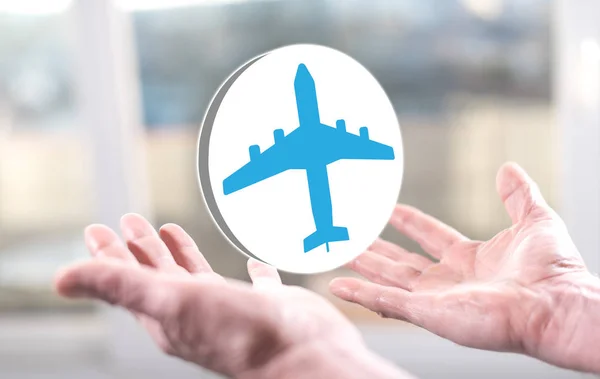 Air transport concept above the hands of a man