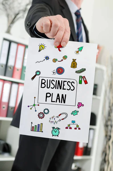 Business plan concept shown by a businessman — Stock Photo, Image