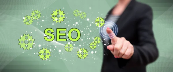 Woman touching a seo concept Stock Image