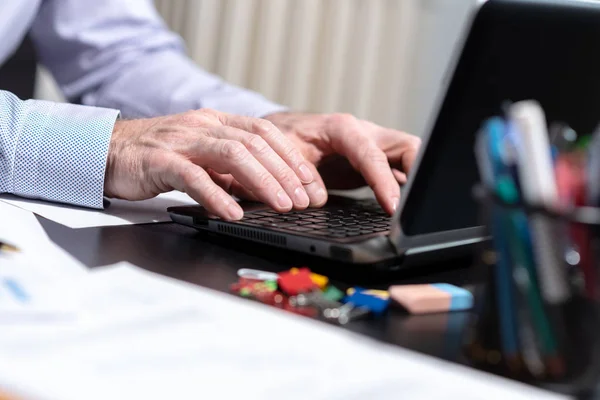 Hands of businessman using laptop, light effect — Stock Photo, Image