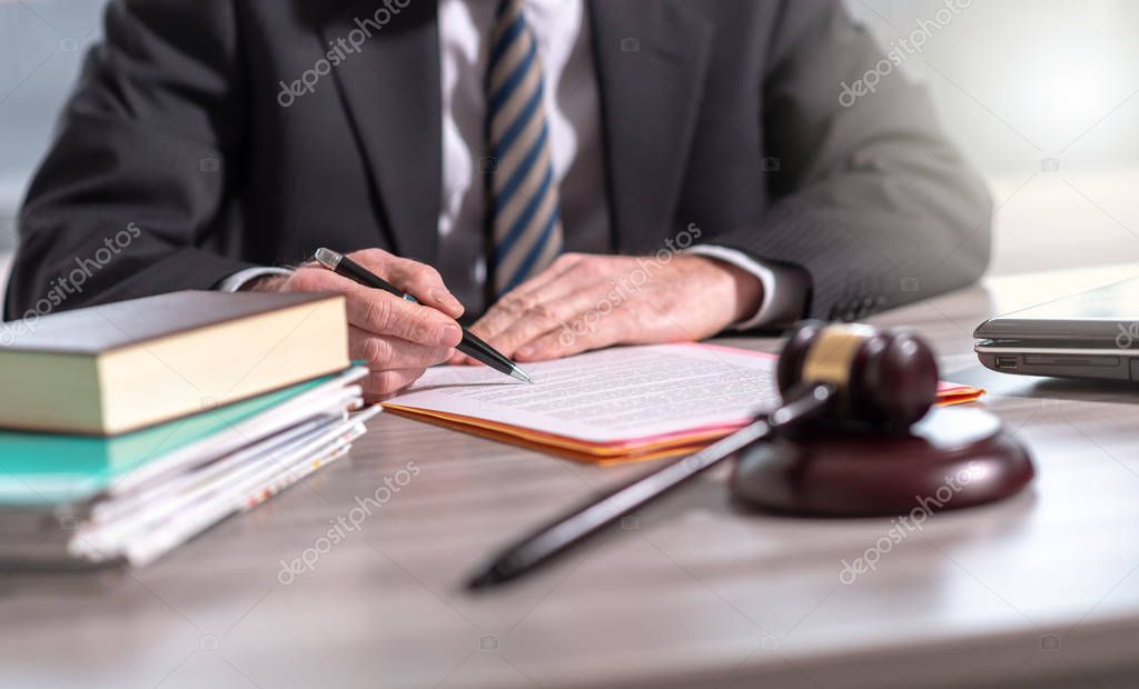 Lawyer reading legal document