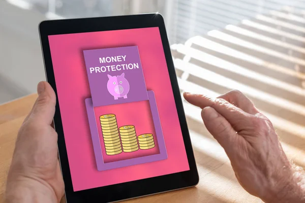 Money protection concept on a tablet