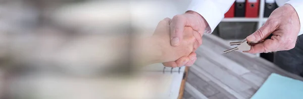 Handshake in a real estate transaction. panoramic banner — Stock Photo, Image