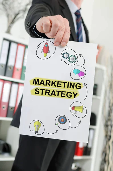 Marketing strategy concept shown by a businessman — Stock Photo, Image