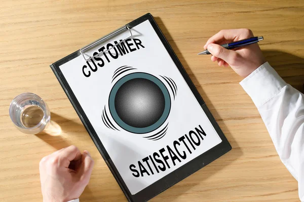 Customer satisfaction concept on a desk — Stock Photo, Image
