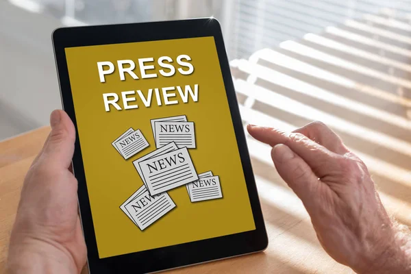 Press review concept on a tablet