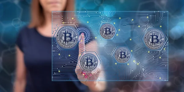 Woman touching a bitcoin concept — Stock Photo, Image