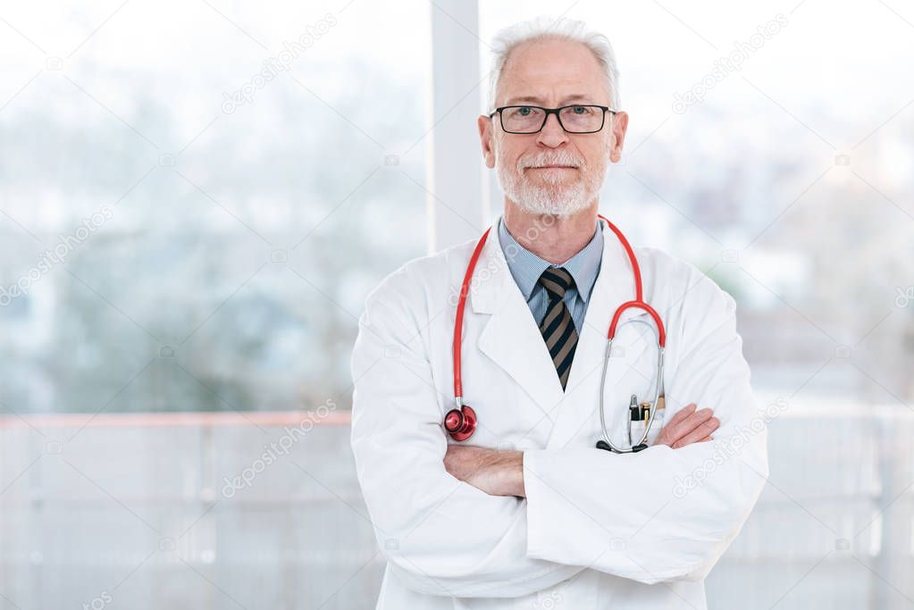 Senior doctor with arms crossed