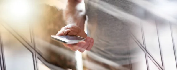 Man using his smartphone; multiple exposure