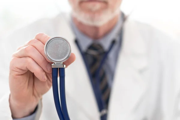 Male doctor holding stethoscope — Stock Photo, Image