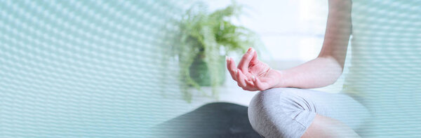 Woman doing yoga; panoramic banner