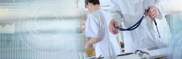 Doctor holding a stethoscope; panoramic banner