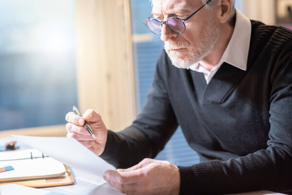Senior businessman reading a document