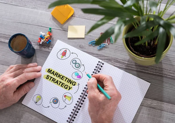 Marketing stratégia koncepció egy Jegyzettömb — Stock Fotó