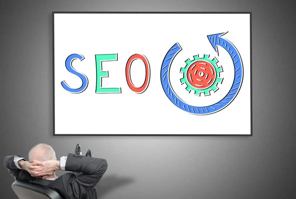 Empresario mirando el concepto seo — Foto de Stock