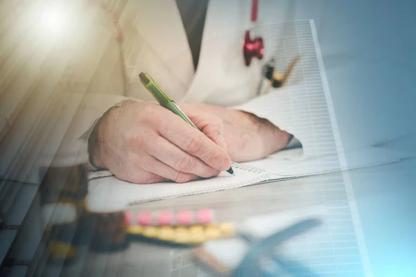 Doctor taking notes; multiple exposure — Stock Photo, Image