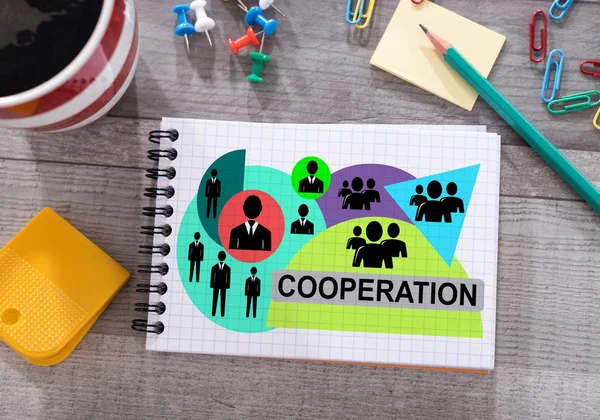Concepto de cooperación en un bloc de notas —  Fotos de Stock
