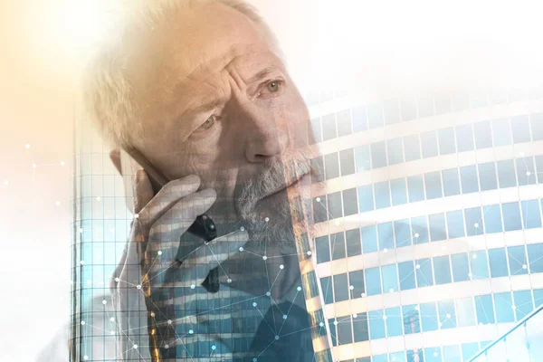 Senior businessman talking on mobile phone; multiple exposure — Stock Photo, Image