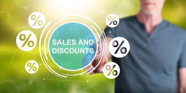 Man touching a sales and discounts concept — Stock Photo, Image