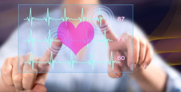 Woman touching a heart beats graph concept — Stock Photo, Image