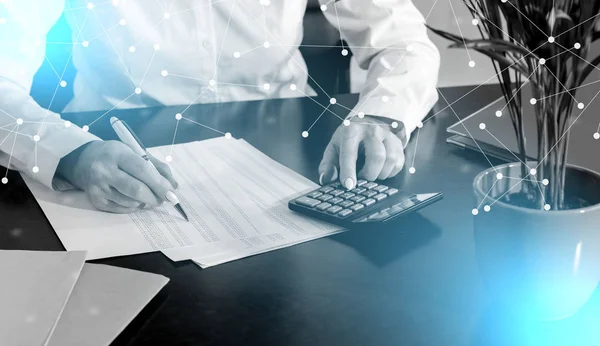 Woman doing her accounting; light effect — Stock Photo, Image