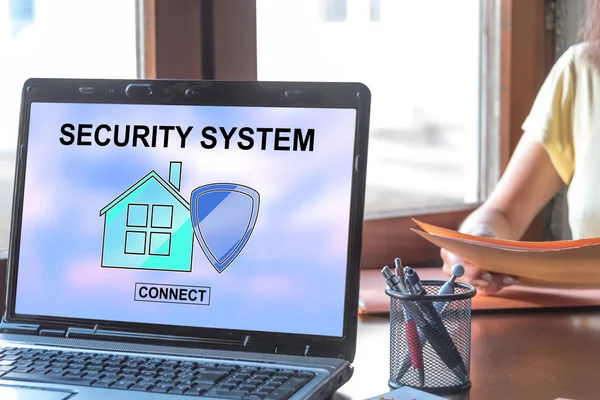 Home security system concept on a laptop screen