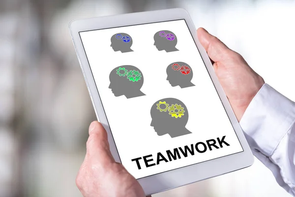 Man Holding Tablet Showing Teamwork Concept — Stock Photo, Image