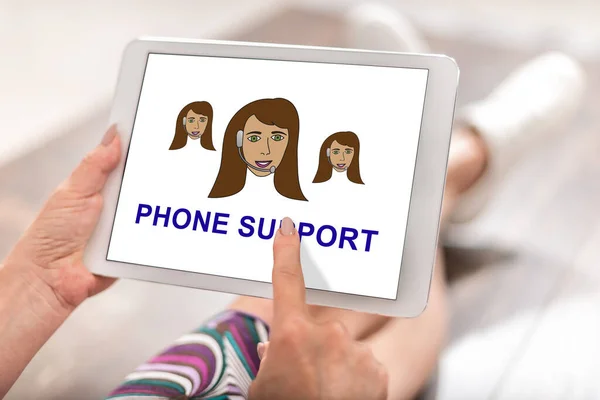 Woman using a tablet with phone support concept