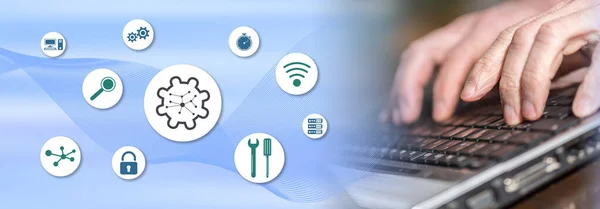 Concept of network management with hands typing on a laptop keyboard