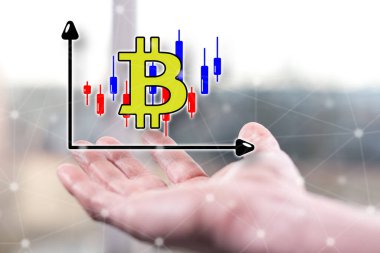 Bitcoin ticaret konsepti bir adamın elinin üstünde.