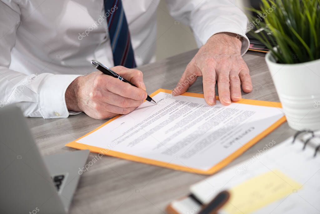 Hand of businessman signing a contract 