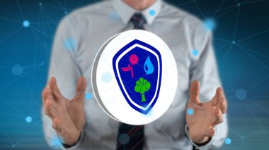 Arka planda bir adamın elleri arasındaki doğa koruma kavramı