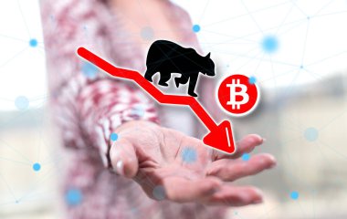 Bitcoin ayı eğilimi kavramı arka plandaki bir kadının elinin üstünde