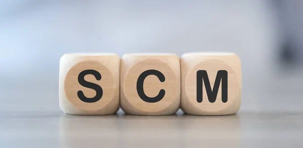 Concept Scm Wooden Cubes — Stock Photo, Image