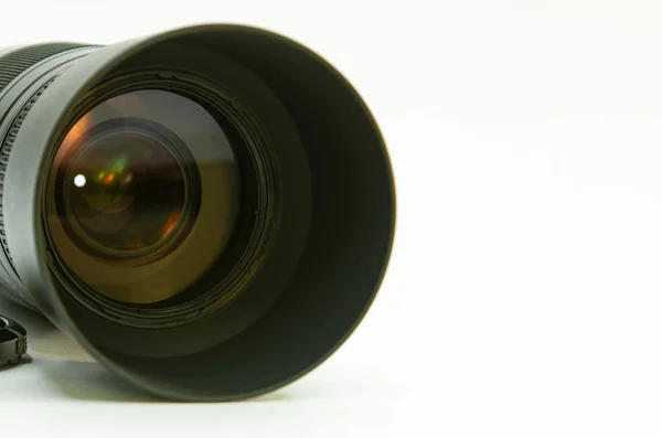 Photographic lens with color reflection on a white background. — Stock Photo, Image