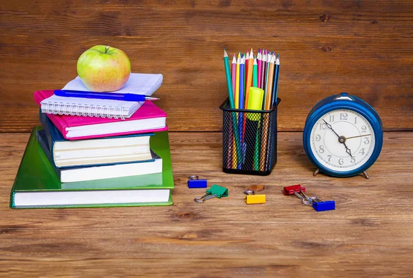 The time has come, back to school! School supplies, on wooden background.