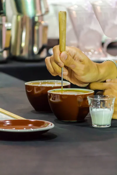 Showcase Barista making Latte art coffee.