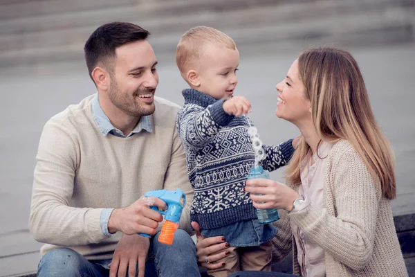 Happy Young Family Making Bubbles Outdoor — Stock Photo, Image