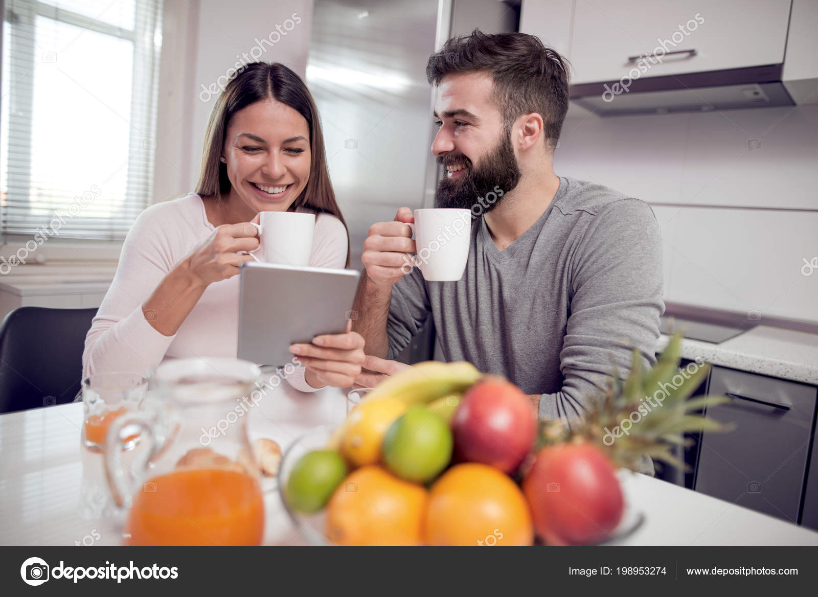 Yong Loving Couple Watching Tablet Drink Coffee Talk Kitchen Stock Photo Image By Ivanko1980 198953274