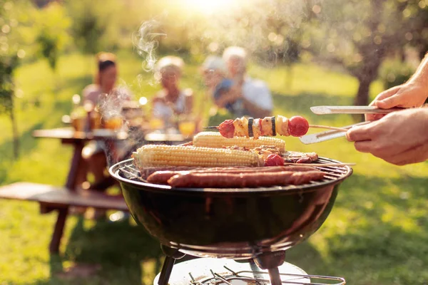 Happy Family Barbecuing Meat Grill — Stock Photo, Image