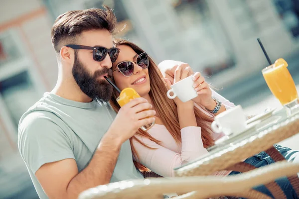 Beautiful couple having coffee on a date,having fun together.